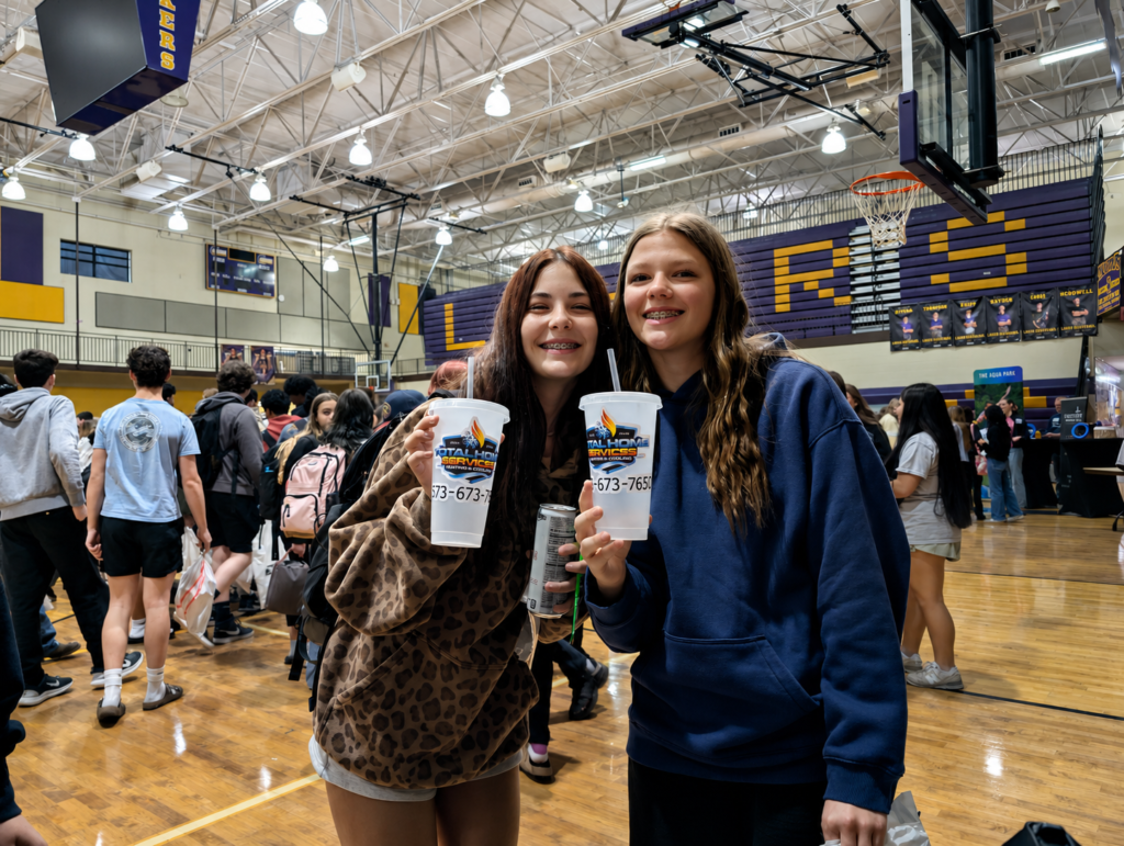 High school students holding Total Home Services Heating & Cooling branded cups at the 2026 Camdenton High School job fair